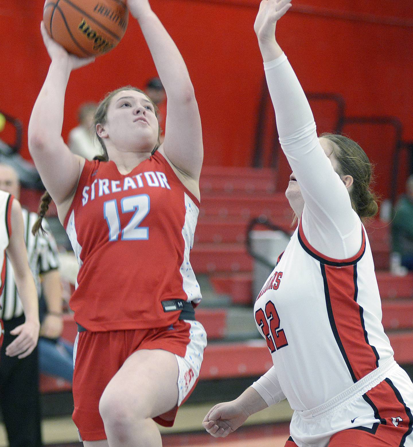 Streator’s Leah Krohe lets go with shot pass the attempted block of Earlville’s Addie Scherer in the second quarter Saturday at Earlville.