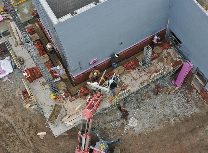 Crews began laying bricks on the exterior wall of the La Salle-Peru Township High School's new Agriculture Center on the southeast corner of Sixth and Creve Coeur streets on Wednesday, April 1, 2026 in La Salle.