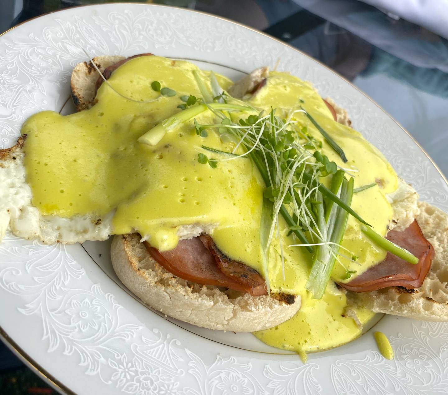 The eggs benedict at Launch Kitchen are served with over easy eggs instead of the traditional poached.
