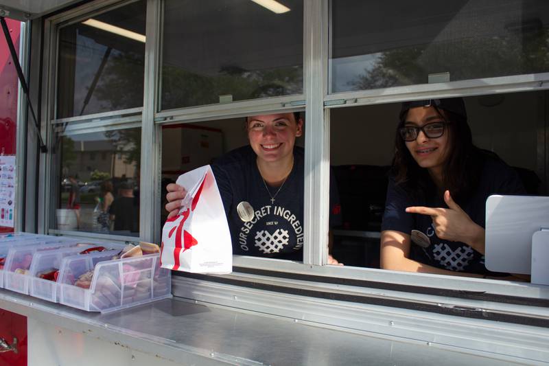 Julie Bruno, of Bourbonnais, and Sophia Kovaka, of Manteno, work the Chick-Fil-A food truck during the 5th annual Bourbonnais Food Truck Festival on Saturday, Aug. 16, 2025.