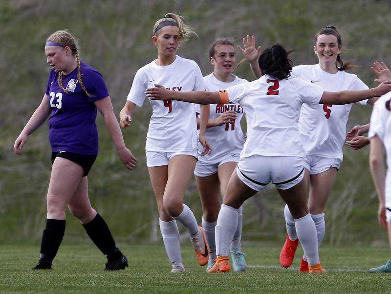 Huntley's Gabi Farraj (second from right) celebrates a goal by teammate, Maizie Nickle (right) with Nickle, Brooke Maxedon (second from left) and Sofia Bruns (third from left) as Hampshire's Madison Koth walks away from the celebration during a Fox Valley Conference soccer game on Tuesday, April 23, 2024, at Hampshire High School.