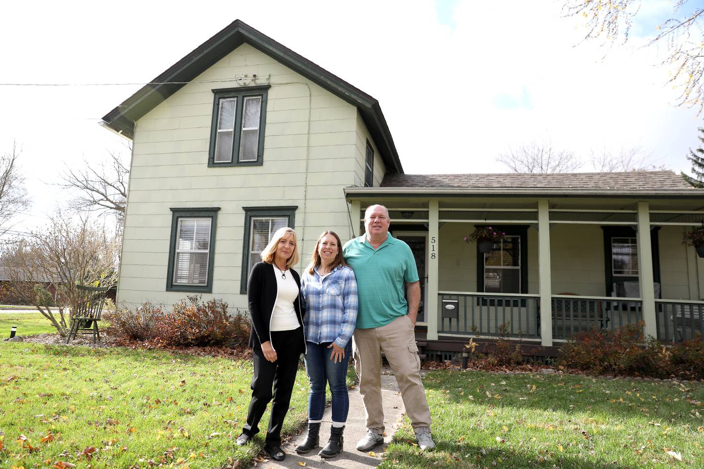 Realtor Brenda Weaver (left) with her clients Angela and Mike Way outside their home in Plano, which is currently listed for sale.
