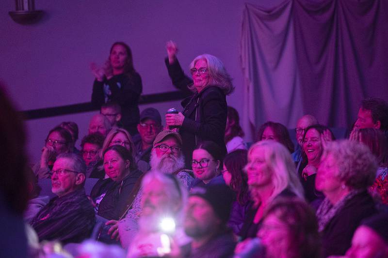 Fans of Head East sing along and gesture Saturday, April 22, 2023 during their show at the Dixon Historic Theatre.