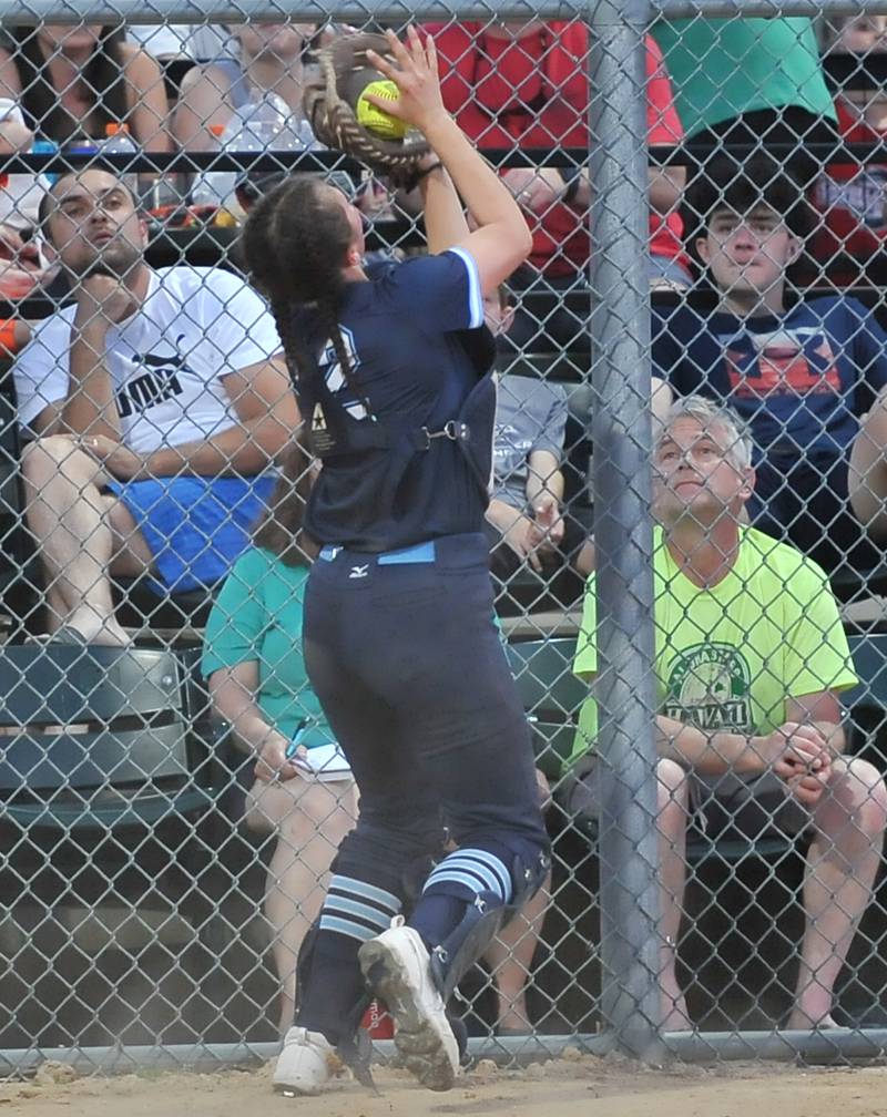Downers Grove South catcher Gracie Lapacek makes a putout of a Downers Grove North batter's foul ball during a game on May. 12, 2022 at McCollum Park in Downers Grove.