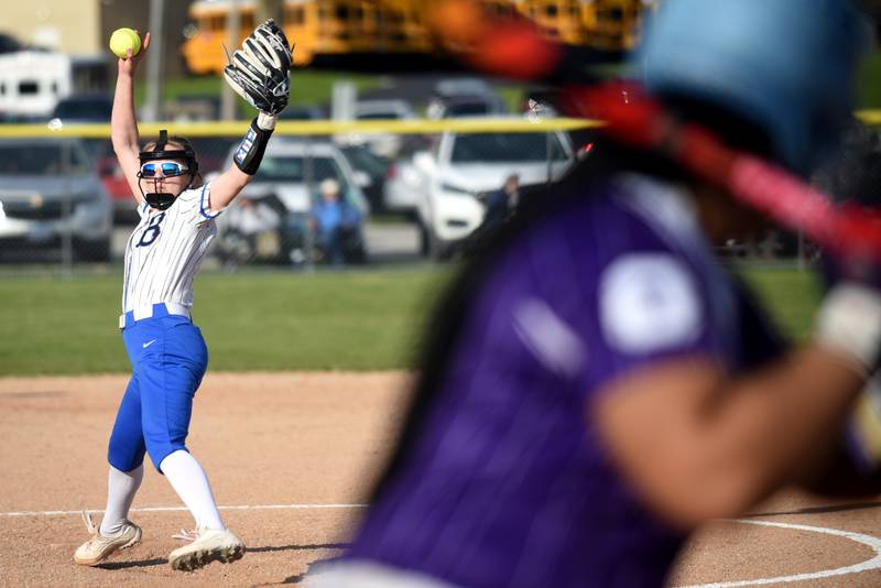 Milford-Cissna Park's Kami Muehling, left, throws a pitch to Oakwood's Je'Lanna Tall during a game at Milford Wednesday, April 16, 2025.