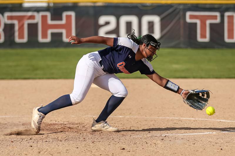 A come backer eludes Oswego's Jaelynn Anthony (20) during Class 4A Plainfield North Sectional final softball game between Wheaton North at Oswego. May 31th, 2024.