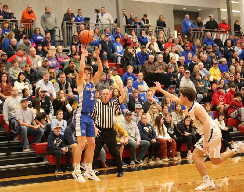 Princeton's Teegan Davis sinks a wide-open three point basket over Marquette's Tommy Durdan during the Colmone Classic tournament on Friday, Dec. 9, 2022 at Hall High School in Spring Valley.