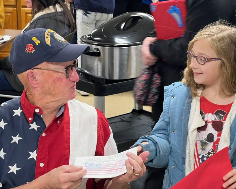 Navy veteran Craig Wolfe accepts a thank-you letter Thursday at a veterans breakfast at the Whiteside County Senior Center in Sterling.