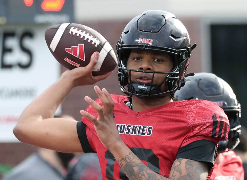 Northern Illinois University quarterback Bryshawn Brown throws a pass Tuesday, April 14, 2026, during a drill at spring practice in Huskie Stadium at NIU in DeKalb.