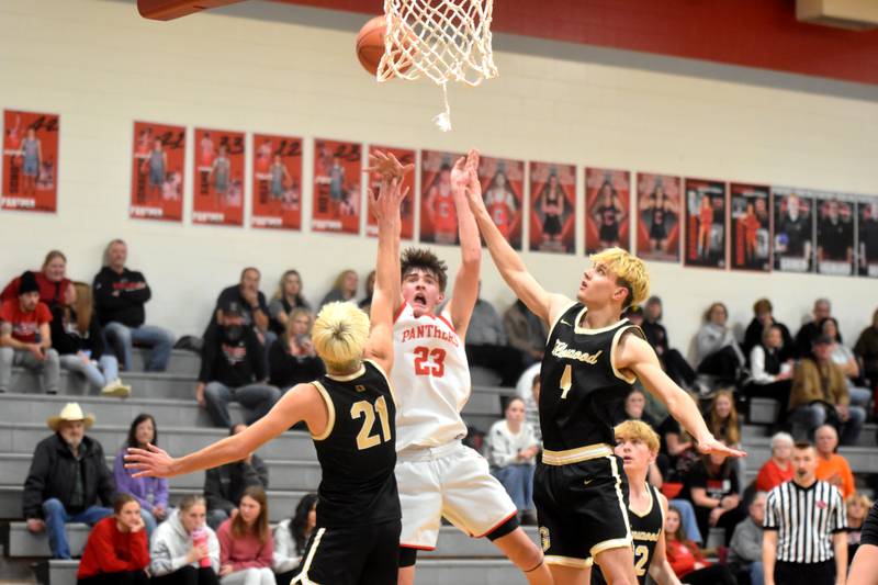 Creston’s Jake Hoyt makes a shot in double coverage Friday in a 68-54 home loss to Glenwood. Hoyt put up a team-high 23 points.