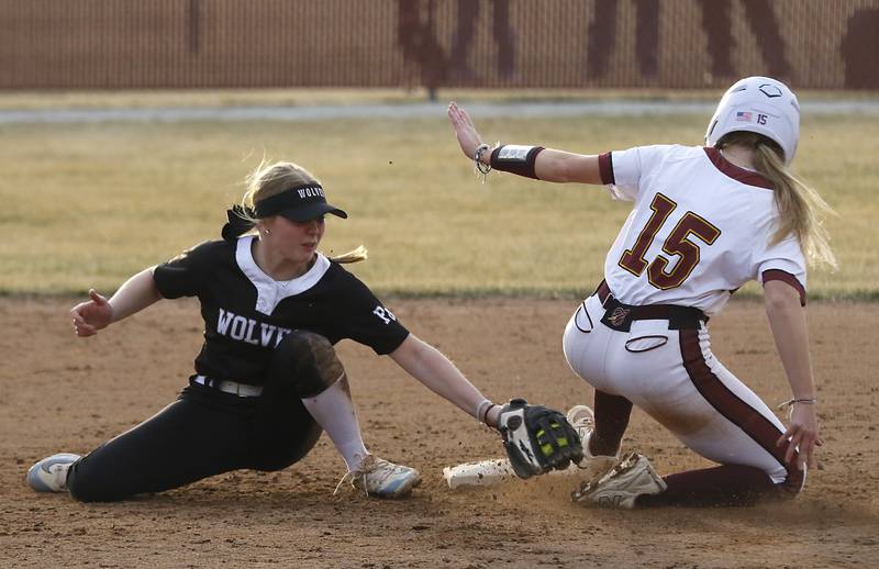 Prairie Ridge's Ady Kiddy tries to tag Richmond-Burton’s Rebecca Lanz as she slides into second base during a nonconference softball game on Tuesday, March 18, 2025, at Richmond-Burton High School.