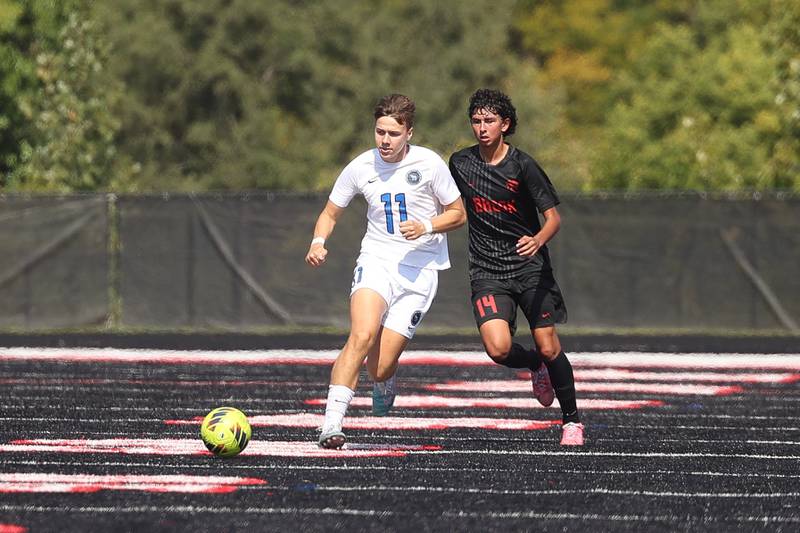 Lincoln-Way East’s Joshua Mensching works the ball upfield against Bolingbrook on Saturday, Sept. 30, 2023 in Bolingbrook.