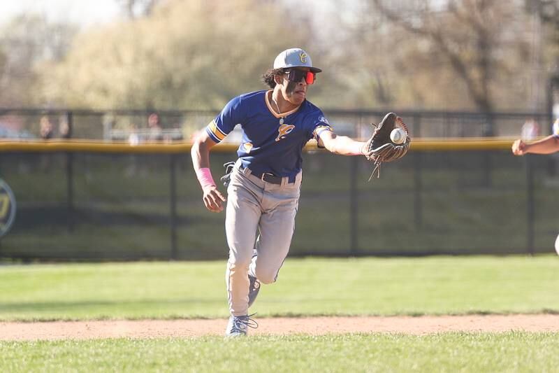 Joliet Central’s Andrew Nixon fields the ball against Joliet West on Monday, April 15, 2024.