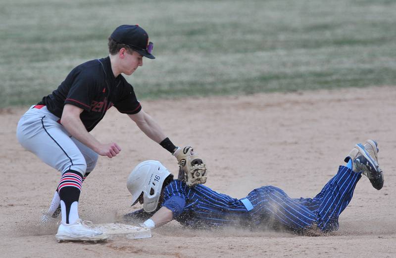 Nazareth's Jacob Castaneda was called out stealing as Benet Academy shortstop Cole Rosenthal applies the tag at second base during a game on Apr. 12, 2022 at Nazareth Academy in LaGrange Park.