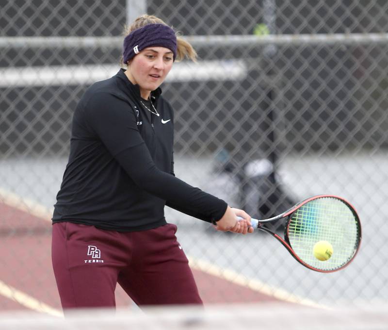 Prairie Ridge’s Megan Clark returns the ball Thursday, Oct. 20, 2022, during during the first day of the IHSA State Girls Tennis Tournament at Schaumburg High School in Schaumburg.