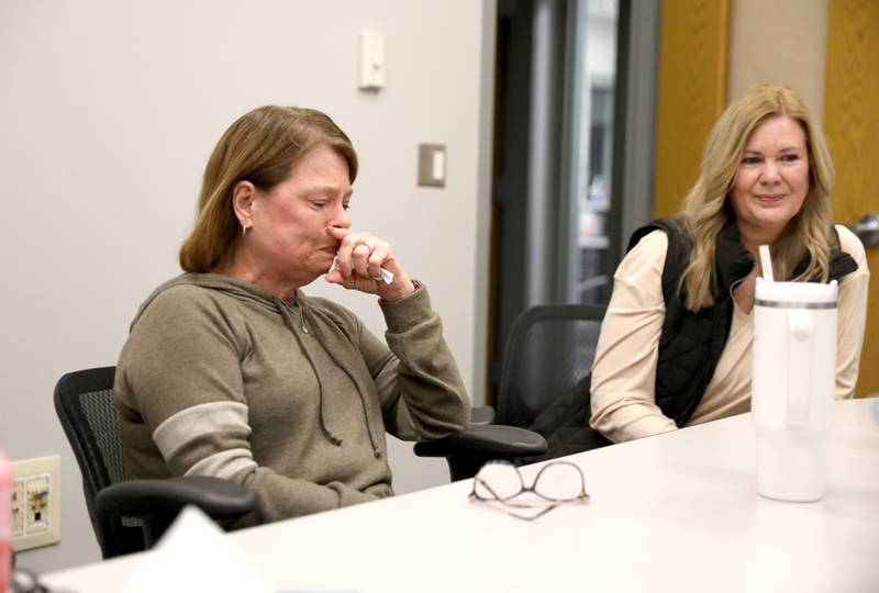 Plano Community Unit School District 88 teacher Susan Love collects herself as she gets emotional speaking about her years teaching as colleague Shelley Schmidt looks on. Both teachers will retire this spring.