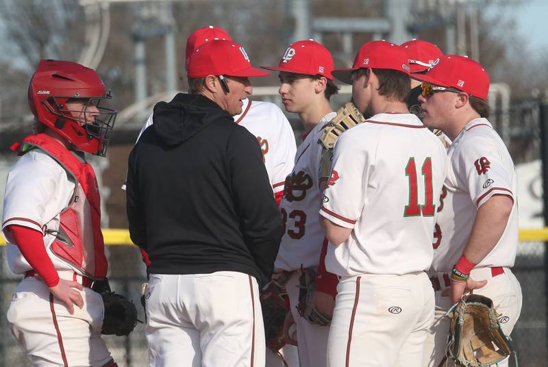 L-P head baseball coach Matt Glupczynski talks to his team while playing Pontiac on Monday, March 24, 2025 at Huby Sarver Field inside the L-P Athletic Complex in La Salle.