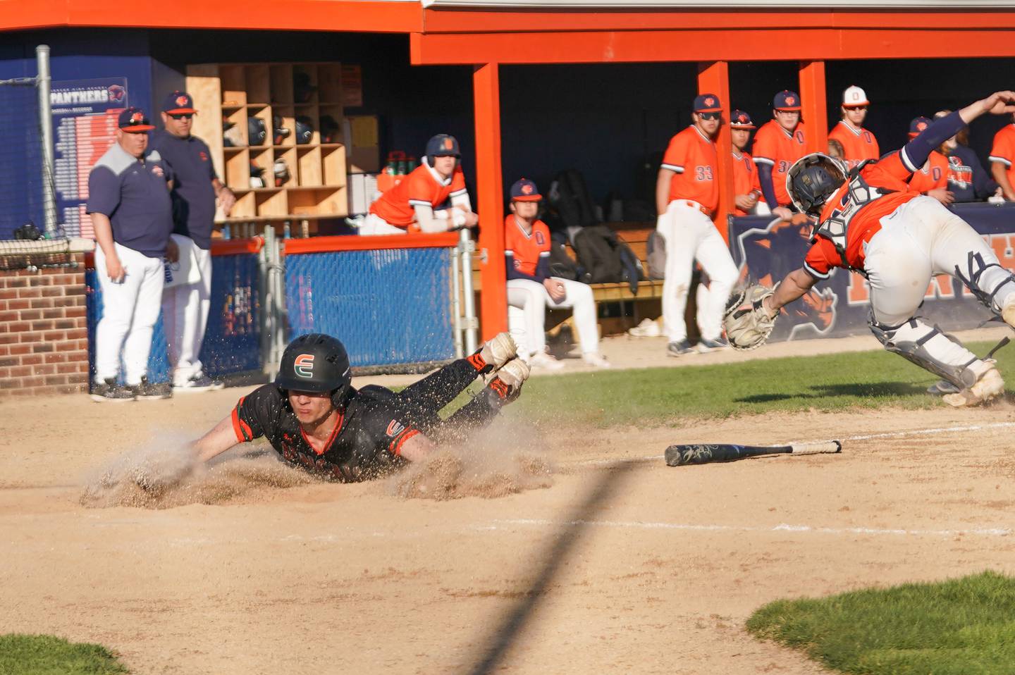 Plainfield East's C.J Przybylski (7) slides in to home for a score against Oswego during a baseball game at Oswego High School on Tuesday, April 9, 2024.