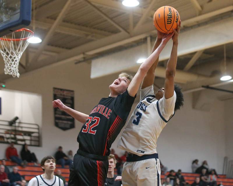 Downers Grove South's Adam Flowers (3) grabs at the ball on a shot attempt by Yorkville's Joey Jakstys (32) during their Class 4A Naperville North Regional final basketball game between Yorkville at Downers Grove South, Feb 27, 2026 in Naperville.