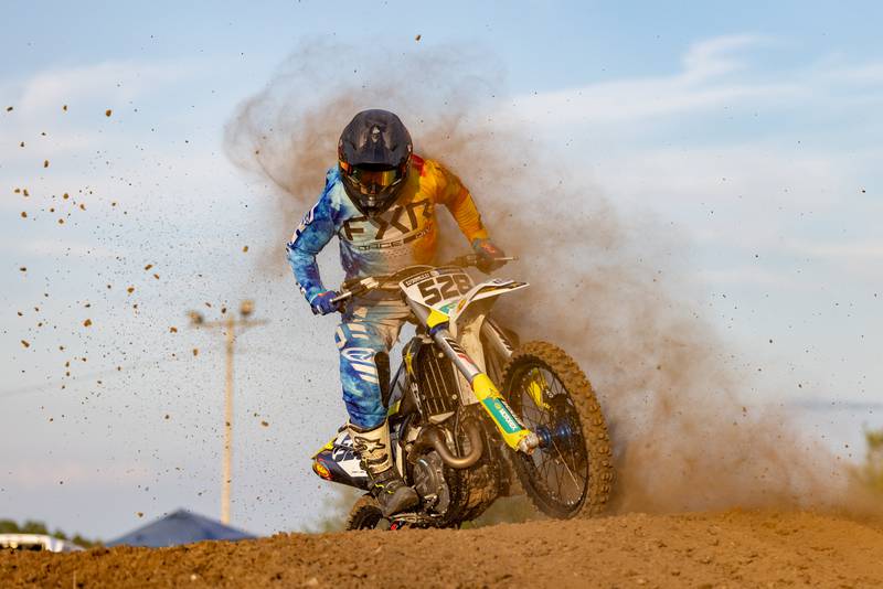 A motocross racer dodges airborne debris known as roost during Megacross at the Tri County Fair on August 30, 2025 in Mendota.