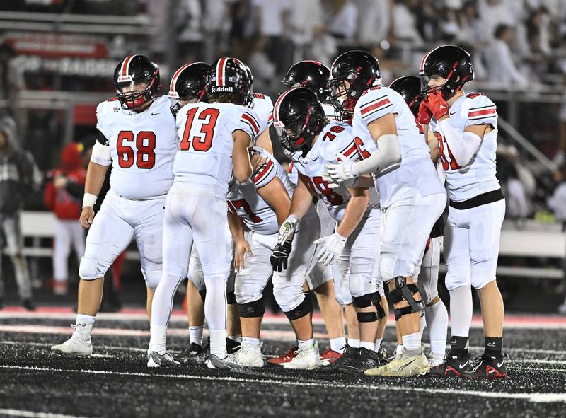 Lincoln-Way Central's offense in the huddle during a non-conference game against Bolingbrook on Friday, Sep. 29, 2023, at Bolingbrook. (Dean Reid for Shaw Local News Network)