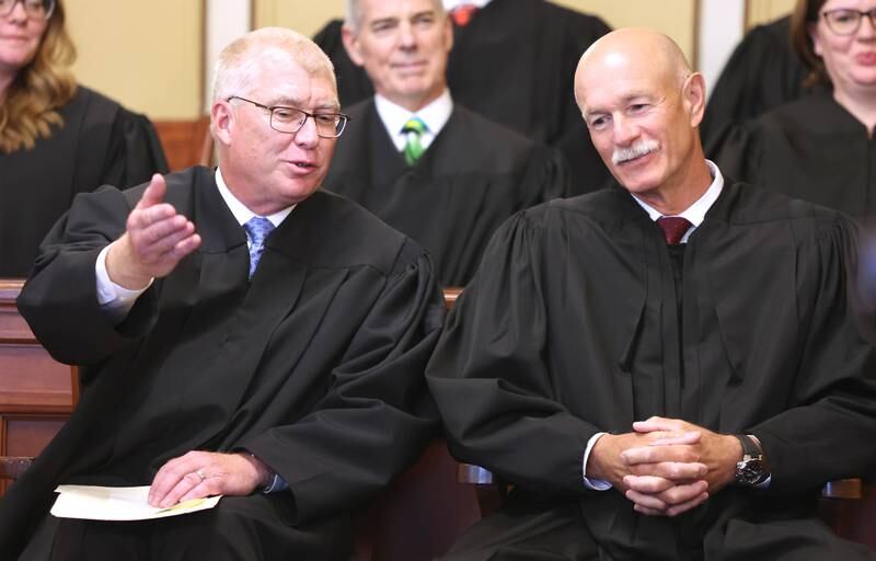 Judge Philip Montgomery (left) and Illinois Supreme Court Justice Michael Burke chat before Montgomery was sworn in as a circuit court judge for the 23rd Judicial Circuit Court Friday, July 15, 2022, at the DeKalb County Courthouse in Sycamore.