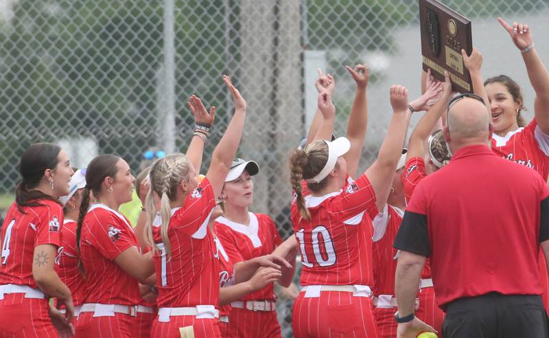 Members of the Bradley-Bourbonnais softball team hoist the Class 4A Supersectional plaque after defeating Edwardsville on Friday, June 6, 2025 at Monticello High School.