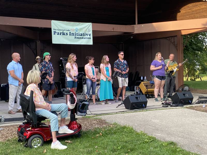 Bryan Younge and members of the Crystal Lake Parks Initiative Foundation accepting the dedication of the Crystal Lake Main Beach bandshell on Tuesday, Aug. 1.