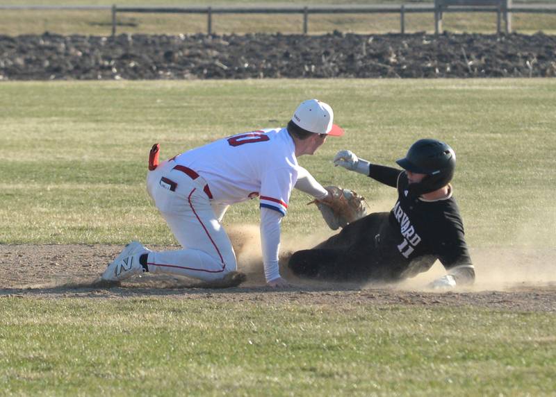 Oregon's Keaton Salsbury tags Harvard's Cole Coffer on Monday, March 23, 2026 at Oregon High School.