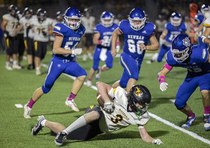 Riverdale’s Caen Beckett is tripped Friday, October 11, 2024, against Newman.