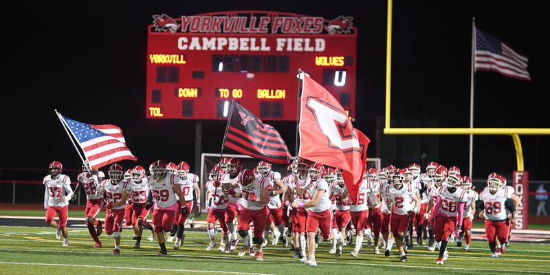 Yorkville takes the field prior to kick off against Oswego East at Yorkville High School on Friday, Oct. 13, 2023.