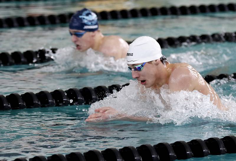 Cary-Grove’s Kasparas Venslauskas (foreground) and D300 Co-op’s Luke Johnson compete in the 200 IM during the Fox Valley Conference Invitational swim meet on Saturday,  Feb. 15, 2025, at Woodstock North High School.