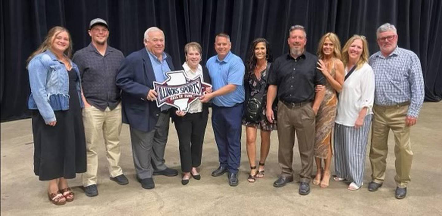 Rich Zinanni, third from left, stands with his family at the Illinois Sports Hall of Fame induction ceremony at the Bank of Springfield Convention Center in Springfield Saturday, June 14, 2025.