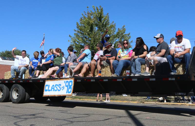The Princeton High School class of 1998 rides on a float during the 52nd annual Homestead Festival parade on Saturday, Sept. 9, 2023 in Princeton.