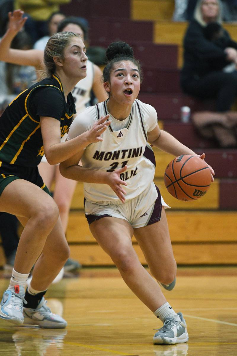 Montini’s Alyssa Epps drives around Fremd’s Brynn Eshoo in a girls basketball game in Lombard on Monday, January 23, 2023.