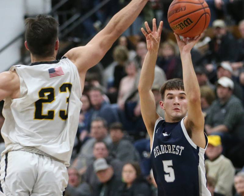 Fieldcrest's Connor Reichman shoots a jump shot over Putnam County's Jackson McDonald on Tuesday, Feb. 7, 2023 at Putnam County High School.