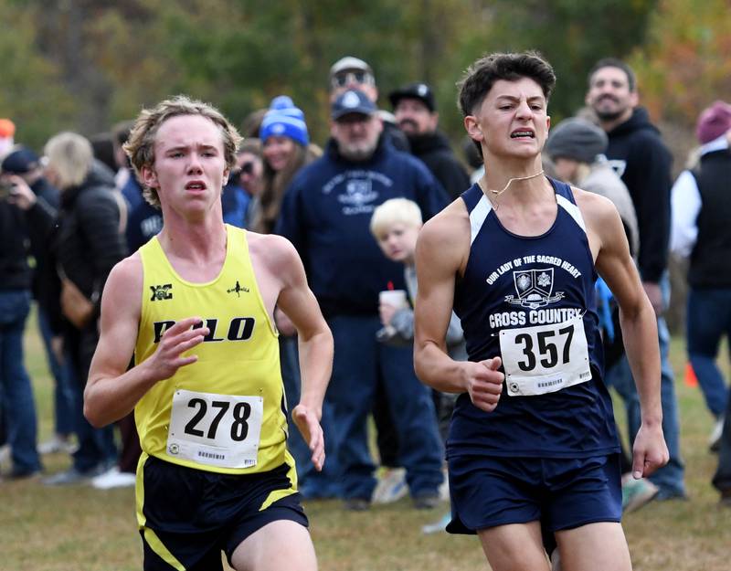Polo-Forreston's Landon Graden (left) races Peter Krein of Rockford's Our Lady of the Sacred Heart to the finish line of  the 1A Winnebago Boys Regional on Saturday, Oct. 25, 2025 at the Levi and Ester Fuller Memorial Forest Preserve.