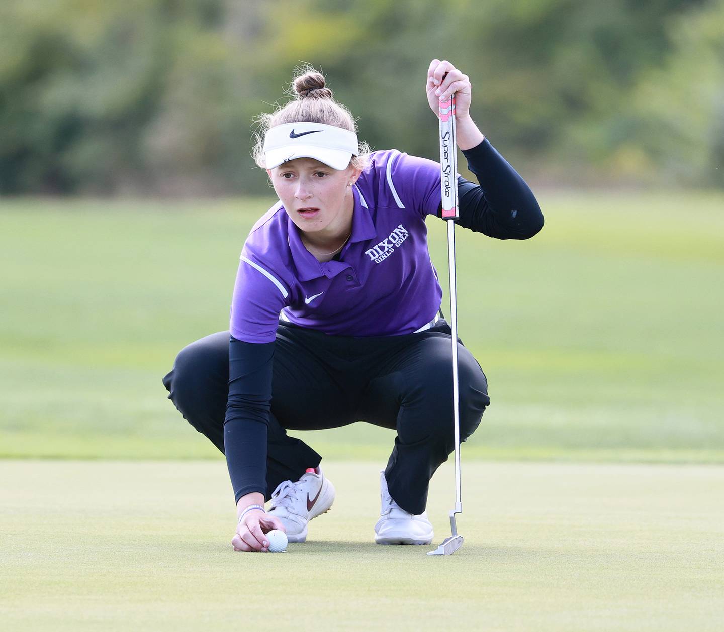 Dixon junior Katie Drew lines up a putt at the Class 1A State Tournament on Saturday, Oct. 8, 2022 at Red Tail Run Golf Course in Decatur. Drew tied for fifth with a two-day total of 4-over-par 148.