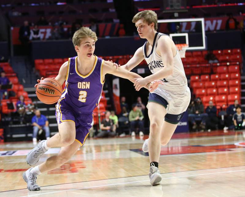 Downers Grove North's James Ordway looks to get around New Trier's Simon Roszak in the Class 4A state third place game on Friday, March 10, 2023 at the State Farm Center in Champaign.