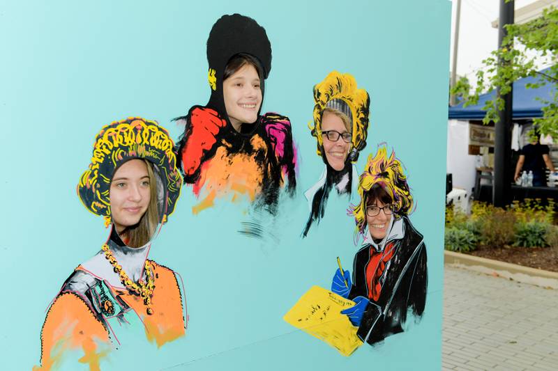 Madison, Mackenzie, Robin Broomfield and Heather Good take a photo in a Warhol style art work during Fine and Cultural Arts Commission’s Andy Warhol’s birthday at the Wheaton French Market on Saturday, August 5, 2023.