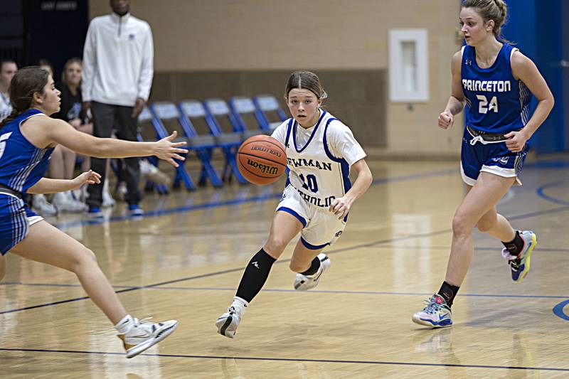 Newman’s Elaina Allen brings the ball up court against Princeton Thursday, Dec. 14, 2023 at Newman High School.