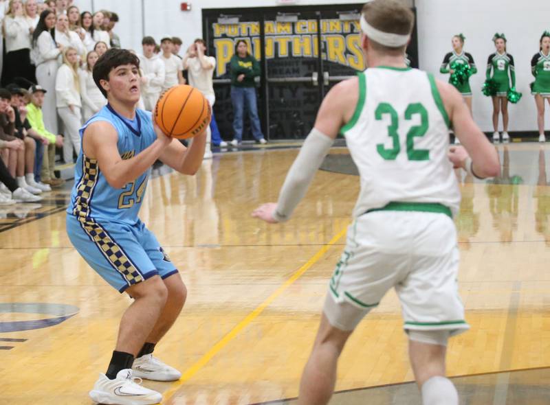 Marquette's Matt Graham shoots a jump shot over Seneca's Paxton Giertz during the Tri-County Conference championship on Friday, Jan. 31, 2025 at Putnam County High School.