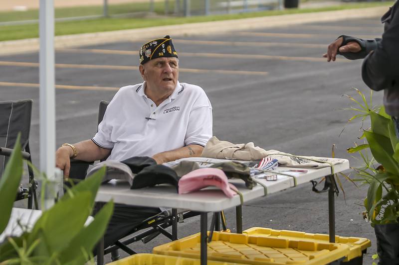 Joe Matkovcik who served as a medic in Vietnam, speaks at the Vietnam Traveling Memorial Wall Thursday, Aug 21, 2025  in Romeoville.