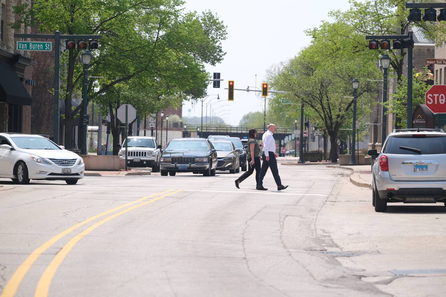 Pedestrians cross North Chicago Street. Tuesday, May 10, 2022, in Joliet.