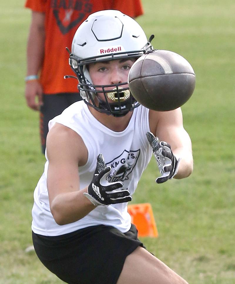 A Kaneland player makes a catch during 7-on-7 drills against DeKalb Tuesday, July 26, 2022, at Kaneland High School in Maple Park.