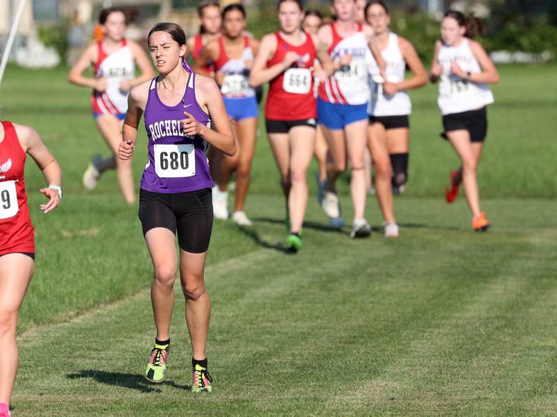 Rochelle’s Annaliese Koziol leads a pack during the girls varsity race Tuesday, Sept. 2, 2025, during the Sycamore Cross Country Invitational at Northern Illinois University in DeKalb.