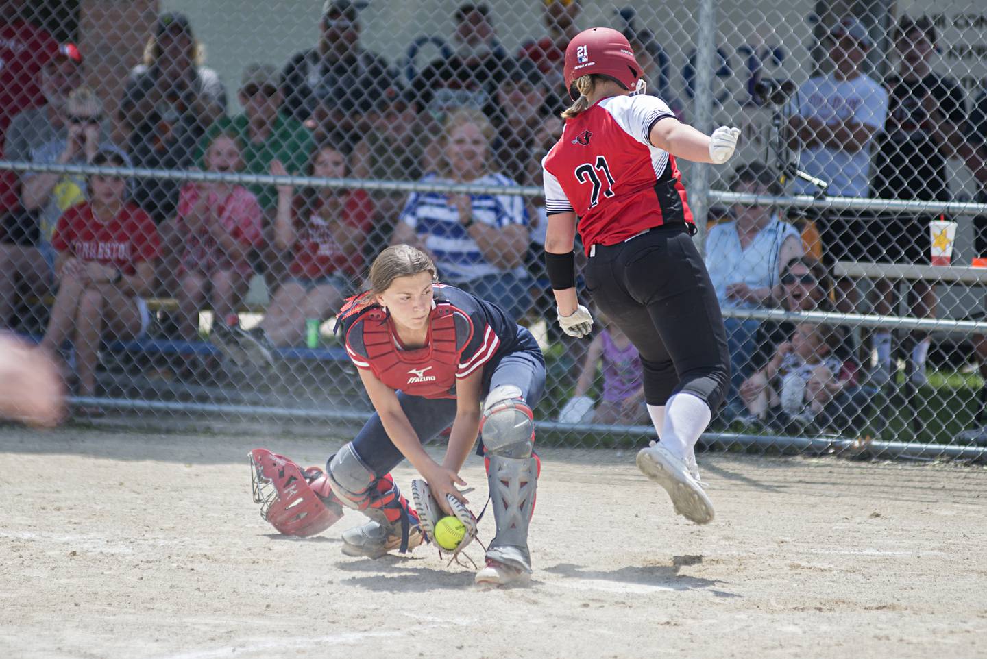 Forreston’s Aubrey Sanders comes in to score to make it a one run game against West Central Monday, May 30, 2022.