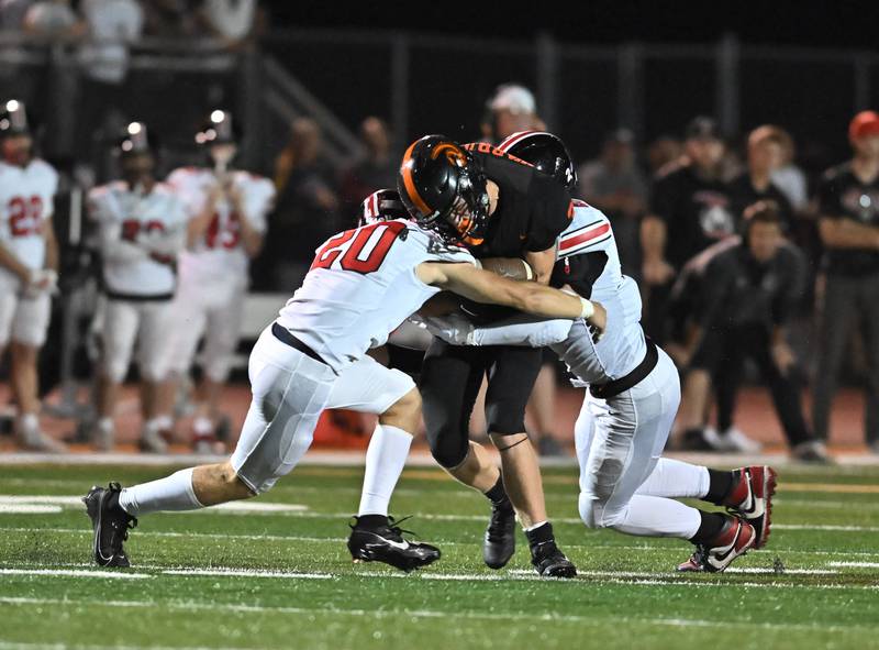 Lincoln-Way Central's Joel Rafferty (20) puts a big hit on Lincoln-Way West's Chase Markowicz (3) during the conference game on Friday, SEP. 19, 2025, at New Lenox.