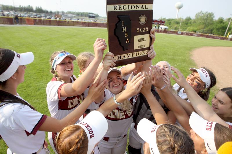 Richmond-Burton’s Rockets celebrate a win over Regina Dominican in Class 2A Regional title softball action at Richmond Friday night.
