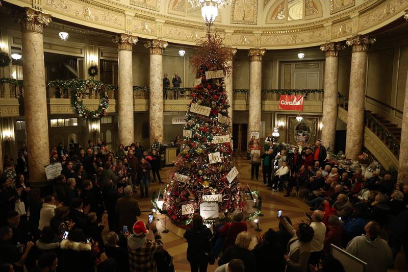 Guest cheer as the Rialto Christmas tree is lit up at the A Very Rialto Christmas show on Monday, November 21st in Joliet.